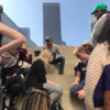 A group of students listening to an instructor