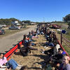 College students on a hayride at Linvilla Orchards on a beautiful fall day with blue skies.